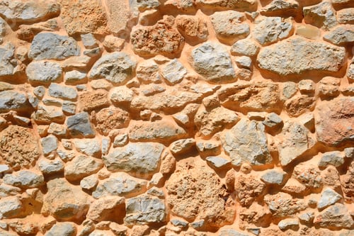 Preview: Old Stone Wall In Malia Town At Crete, Greece.