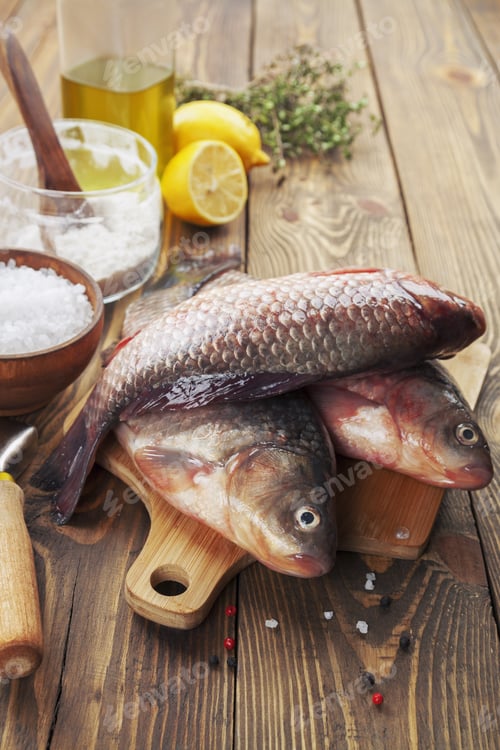 Preview: Fresh Fish Crucian On A Wooden Table