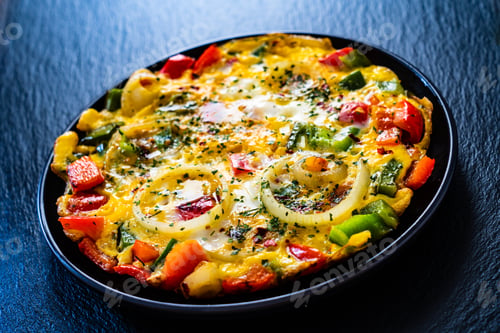 Preview: Breakfast - Scrambled Eggs With Vegetables On Black Stone Background