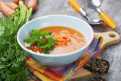 Preview: Carrot Soup In Blue Bowl On The Table