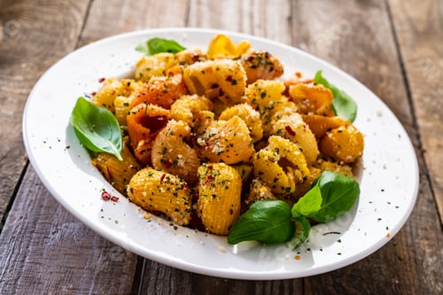 Preview: Pasta With Pesto Sauce On Wooden Table