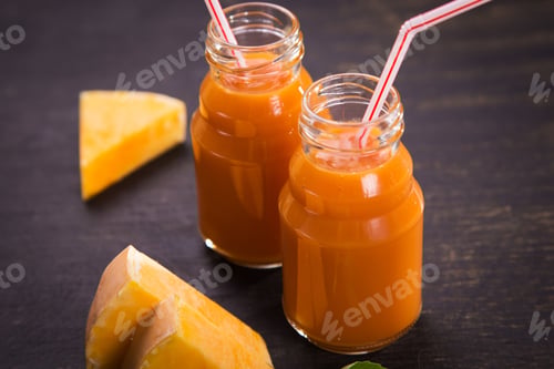 Preview: Fresh Smoothie From Pumpkin With Basil On Wooden Background