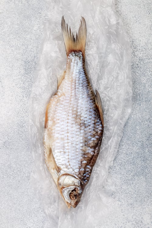 Preview: Dried Salted Fish On Grey Concrete Background. Traditional Russian Appetizer. Selective Focus