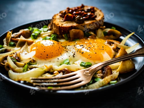 Preview: Continental Breakfast - Sunny Side Up Eggs On White Mushrooms, Onion And Tomato Bruschetta On Black