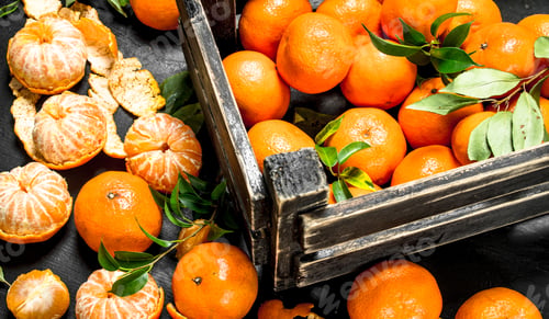 Preview: Fresh Tangerines In A Box. On The Black Chalkboard.