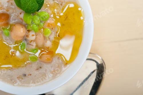 Preview: Hearty Middle Eastern Chickpea And Barley Soup With Mint Leaves On Top