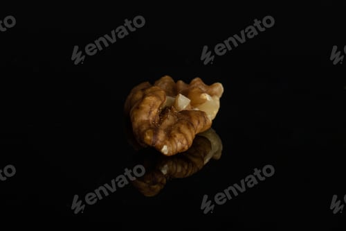 Preview: One Whole Front Focus Brown Almond Nut Isolated On Black Glass
