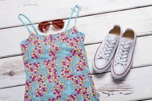 Preview: Blue Top With Colorful Print. Sunglasses And White Shoes. Lady'S Clothes On Wooden Shelf. Best