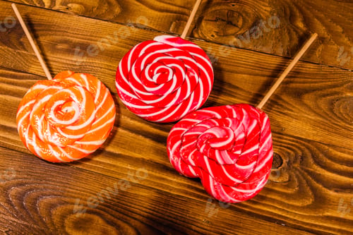 Preview: Big Sweet Lollipops On Rustic Wooden Table