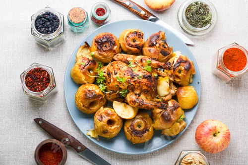Preview: Homemade Whole Chicken Or Partridge Baked With Apples On A Plate