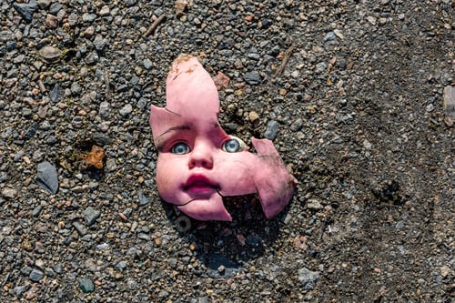 Preview: Scary Broken Doll Face On The Ground
