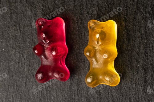 Preview: Group Of Two Whole Gummy Bear Flatlay On Grey Stone
