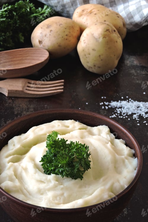 Preview: Mashed Potatoes In A Bowl. Homemade Mashed Potatoes With Fragrant Herbs.