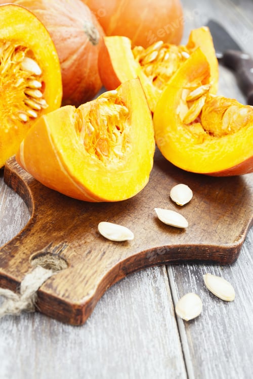 Preview: Small Beautiful Orange Pumpkins On The Kitchen Table