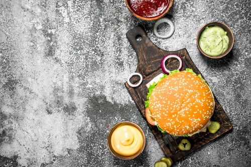 Preview: Fresh Burger From Beef With Vegetables And Various Sauces. On A Rustic Background.