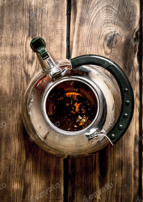 Preview: Fragrant Tea In The Pot. On Wooden Background.