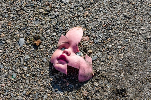 Preview: Scary Broken Doll Face On The Ground