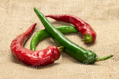 Preview: Group Of Four Whole Fresh Hot Pepper On Jute Cloth