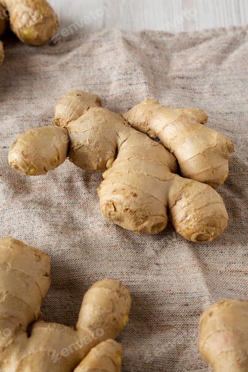 Preview: Raw Organic Ginger Root On Cloth, Low Angle View. Close-Up.