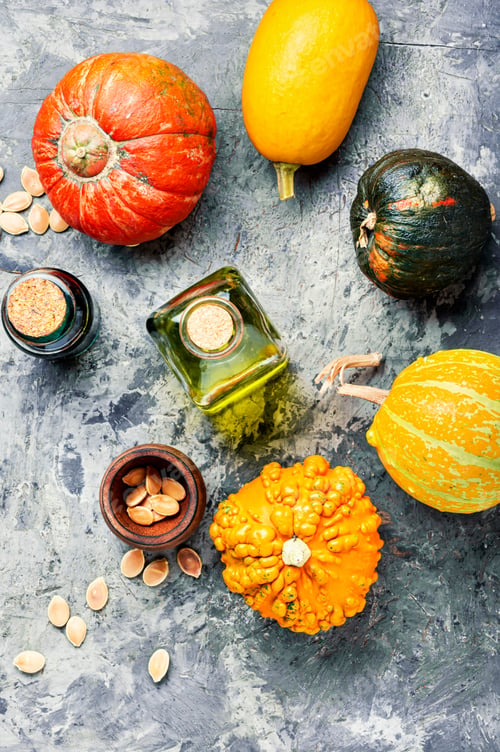 Preview: Pumpkin Oil And Raw Pumpkin.Bowl Of Pumpkin Seed Oil