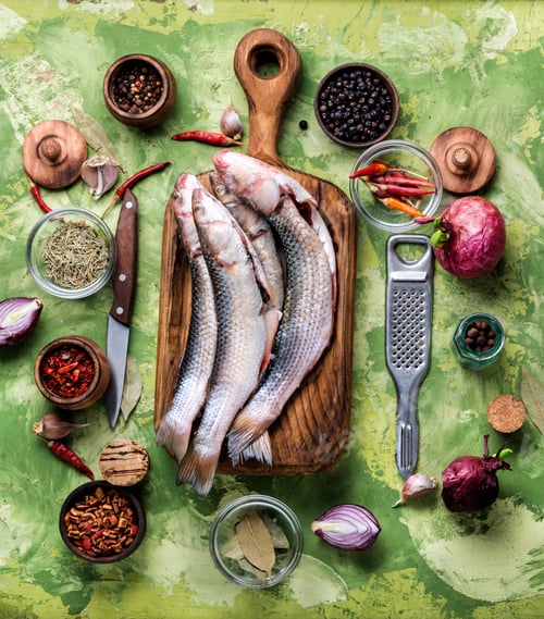 Preview: Fresh Raw Fish On Wooden Cutting Board.Raw Fish With Spices For Cooking.Fish Background