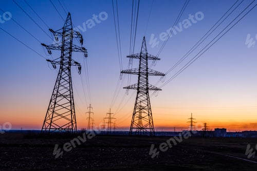 Preview: High Voltage Power Line In Field At Sunset