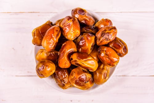 Preview: Date Fruits On A White Wooden Table. Top View