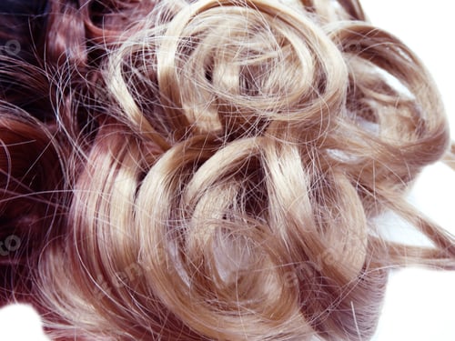 Preview: Close-up of curly blonde and brown hair