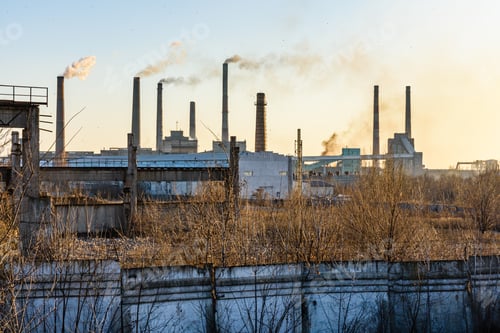 Preview: View On Smoke Pipes Of Factory At Sunset