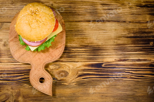 Preview: Fresh Hamburger On Wooden Cutting Board. Top View