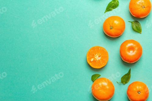 Preview: Ripe Juicy Tangerines And Fresh Leaves. Sunny Summer Turquoise Background, Top View