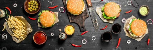 Preview: Street Food. Fresh Burgers With Beef And Vegetables. On The Black Chalkboard.