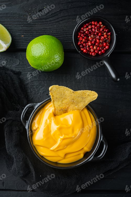 Preview: Bowl With Cheese Dip With Nacho, On Black Wooden Background, Top View Or Flat Lay