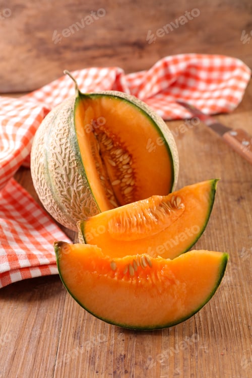 Preview: Melon Slices On Wood Background