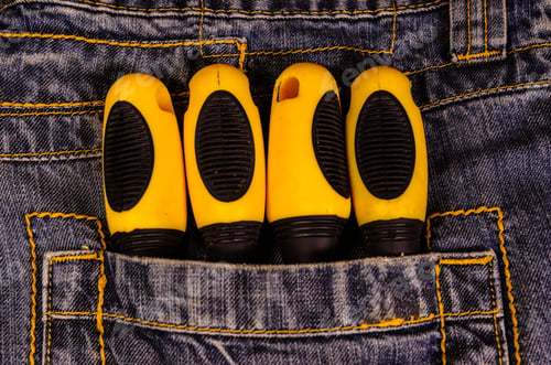Preview: Different Screwdrivers In A Pocket Of The Blue Jeans. Top View