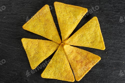 Preview: Group Of Six Whole Cheese Tortilla Chips Like Flower Flatlay On Grey Stone