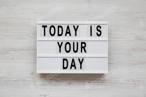 Preview: Modern Board With 'Today Is Your Day' Words On A White Wooden Surface, Top View. Flat Lay