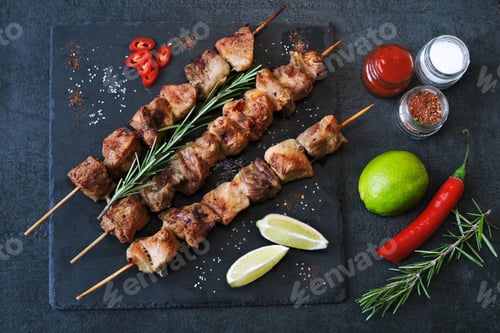 Preview: Appetizing Kebab With Spices, Chili And Lime. Fragrant Pork Skewers On A Stone Board.