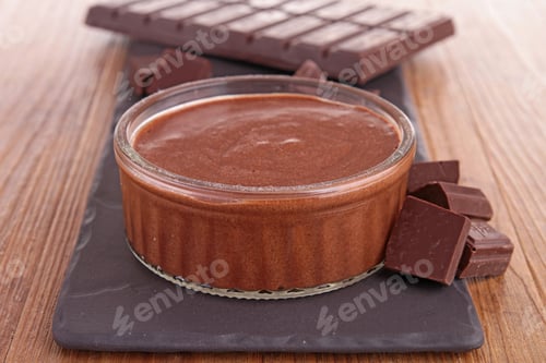 Chocolate Mousse with Chocolate Bar on Wooden Table
