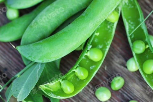 Preview: Pea Pod On The Wooden Background