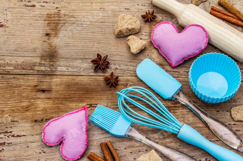 Preview: Valentines Day Baking Background. Silicone Molds For Cupcakes, Spices, Sugar, Whisk, Spatula