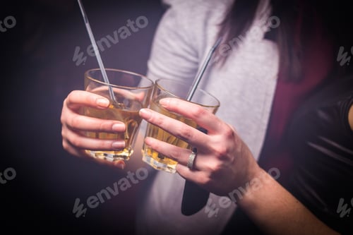 Preview: An Alcoholic Yellow Cocktails Is In Beautiful Glass,In Hands