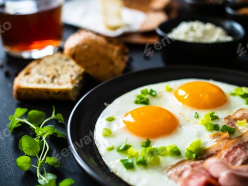 Preview: Continental Breakfast - Sunny Side Up Eggs On Bacon On Wooden Table