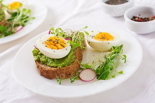 Preview: Healthy Food. Breakfast. Avocado Egg Sandwich With Whole Grain Bread On White Wooden Background.