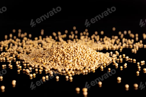 Preview: Lot Of Whole White Mustard Seeds Stack Isolated On Black Glass