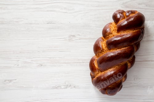 Preview: Homemade Jewish Challah Bread On A White Wooden Surface, Top View. Overhead, From Above, Flat Lay