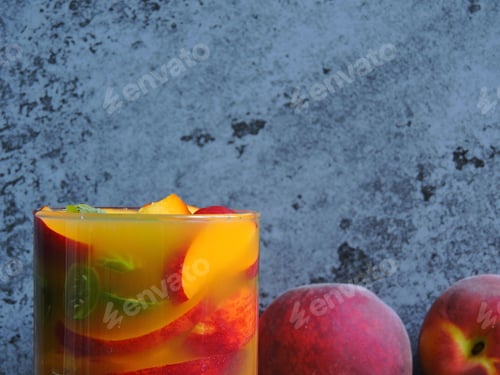 Preview: Drink With Gooseberry And Peach Juice. Copy Space. Background Gray Loft.
