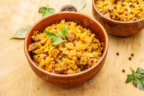 Preview: Stewed (Braised) Cabbage Served On Ethnic Ceramic Bowl. Traditional Polish Bigos With Meat