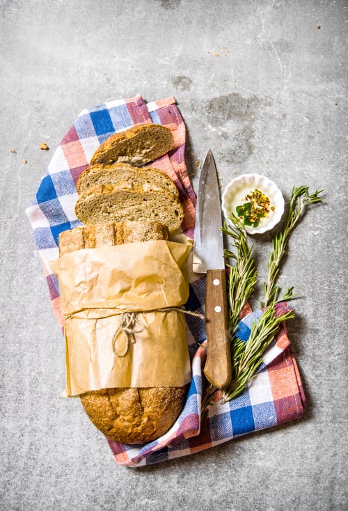 Preview: The Fabric On Ciabatta With Rosemary And A Knife. On The Stone Table. Top View