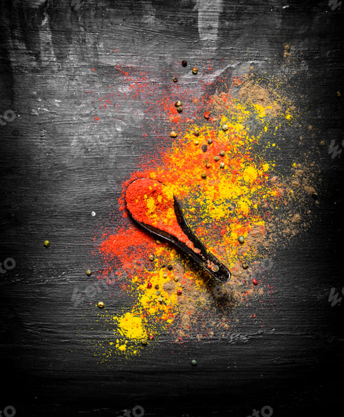 Preview: Ground Spices And Herbs With A Spoon. On The Black Chalkboard.